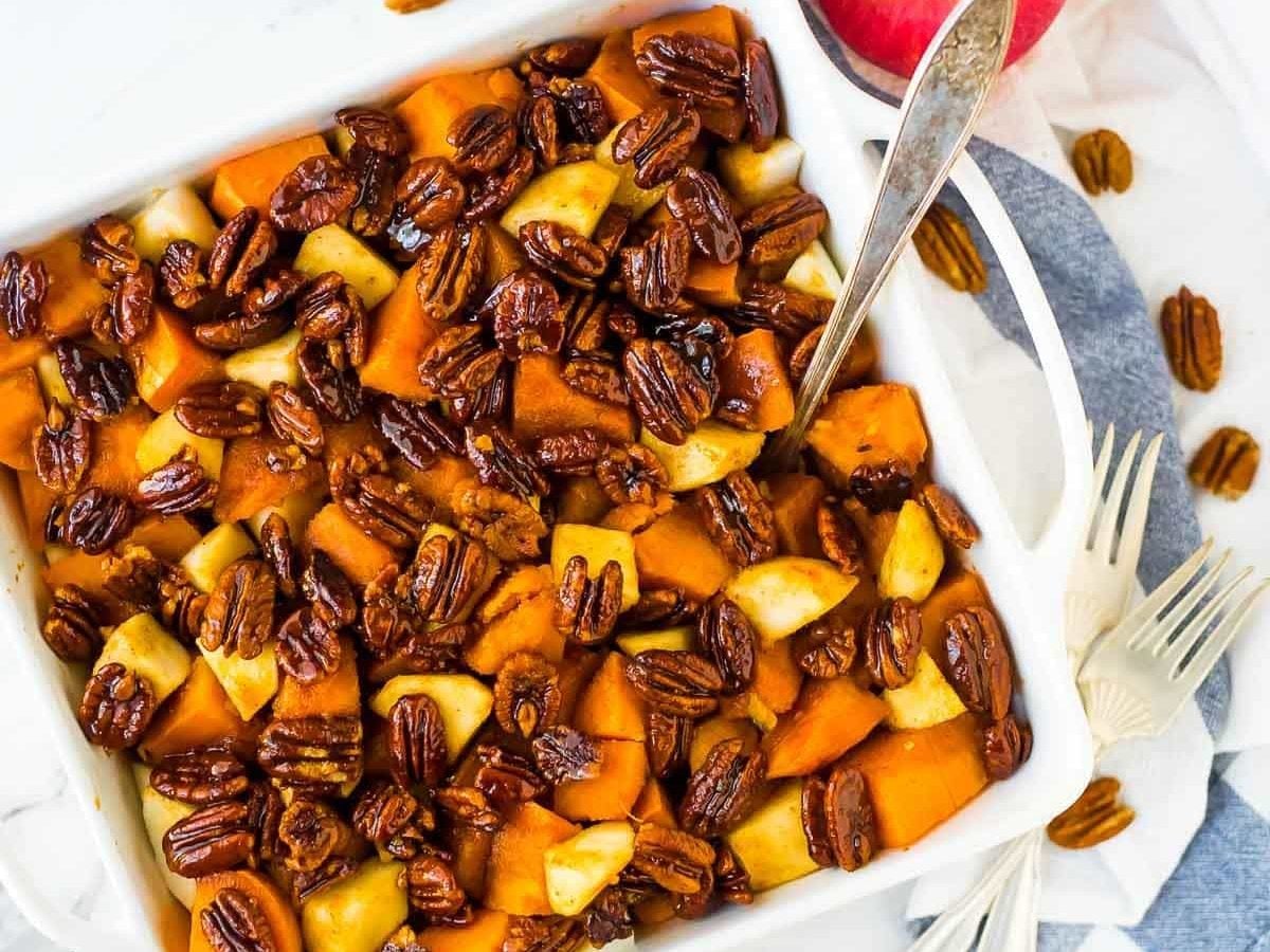 Glazed Sweet Potato Bake with Cinnamon Butter Pecans. The BEST sweet potatoes for Thanksgiving, Christmas, or anytime you need a great side dish recipe. Recipe at wellplated.com | @wellplated