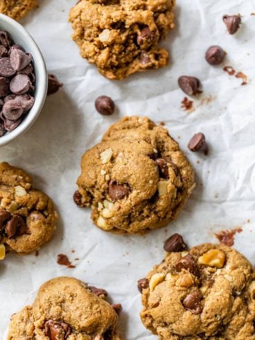 Whole Wheat Walnut Chocolate Chip Cookies on a piece of parchment paper