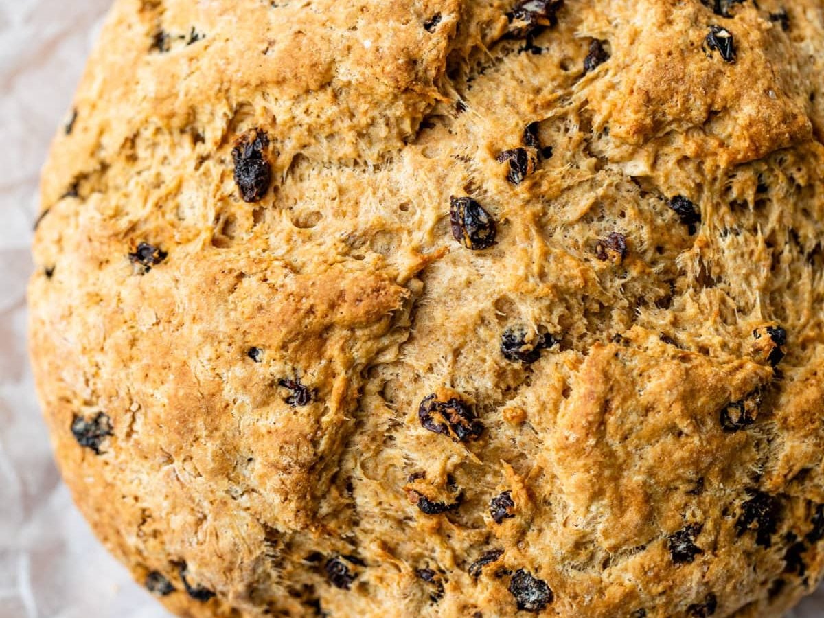 a loaf of fluffy irish soda bread with raisins