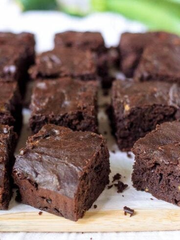 These ultra moist zucchini brownies are made with whole wheat flour, coconut oil, and are naturally sweetened with maple syrup. The best healthy brownie recipe!