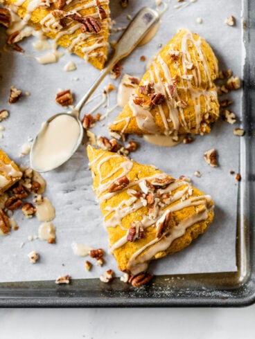 moist pumpkin scones with glaze and pecans