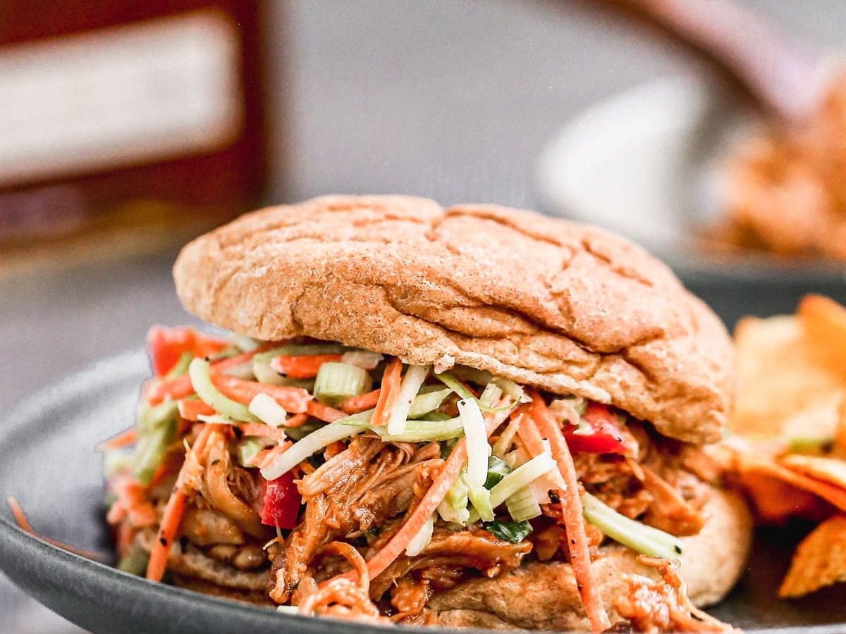 crock pot bbq chicken sandwiches with slaw on top
