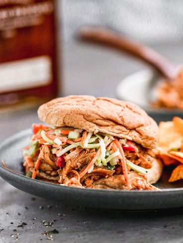 crock pot bbq chicken sandwiches with slaw on top
