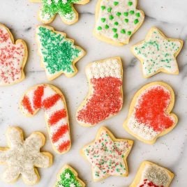 Soft and fluffy Cream Cheese Sugar Cookies with Perfect Icing. The only cut out cookie recipe you will ever need!