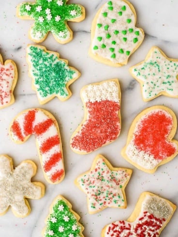 Soft and fluffy Cream Cheese Sugar Cookies with Perfect Icing. The only cut out cookie recipe you will ever need!