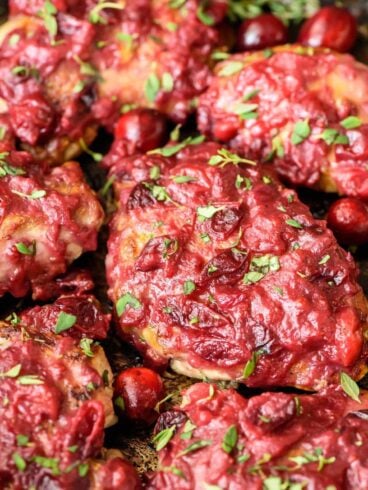 Sticky Cranberry Chicken Thighs. The whole meal cooks in one pan and is healthy AND delicious. Winner dinner!
