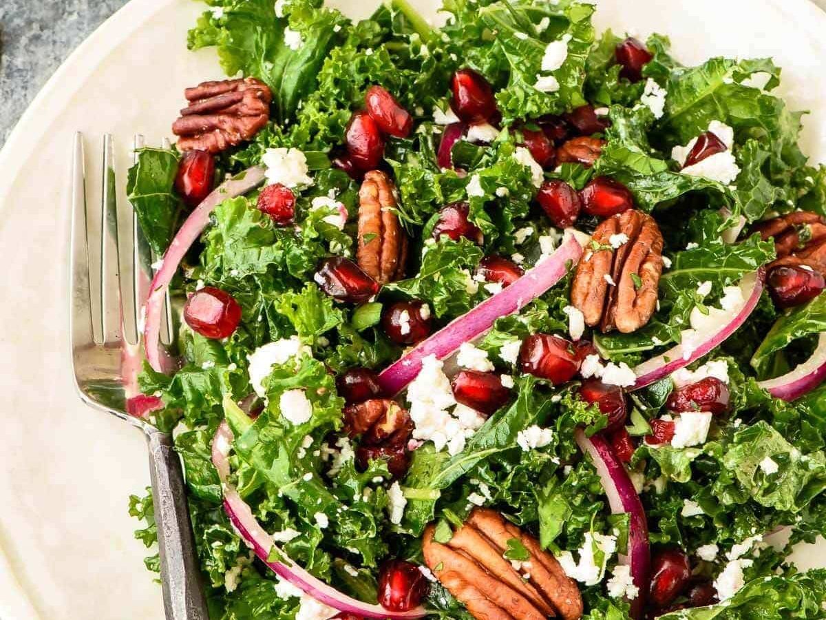 Make ahead Kale Salad with Pomegranate and Pecans. Our favorite winter salad recipe!