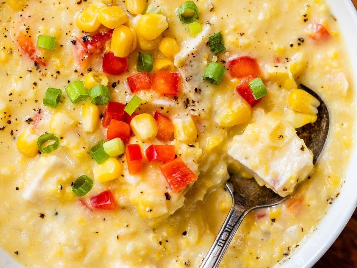 Corn Chicken Chowder in a white bowl with peppers