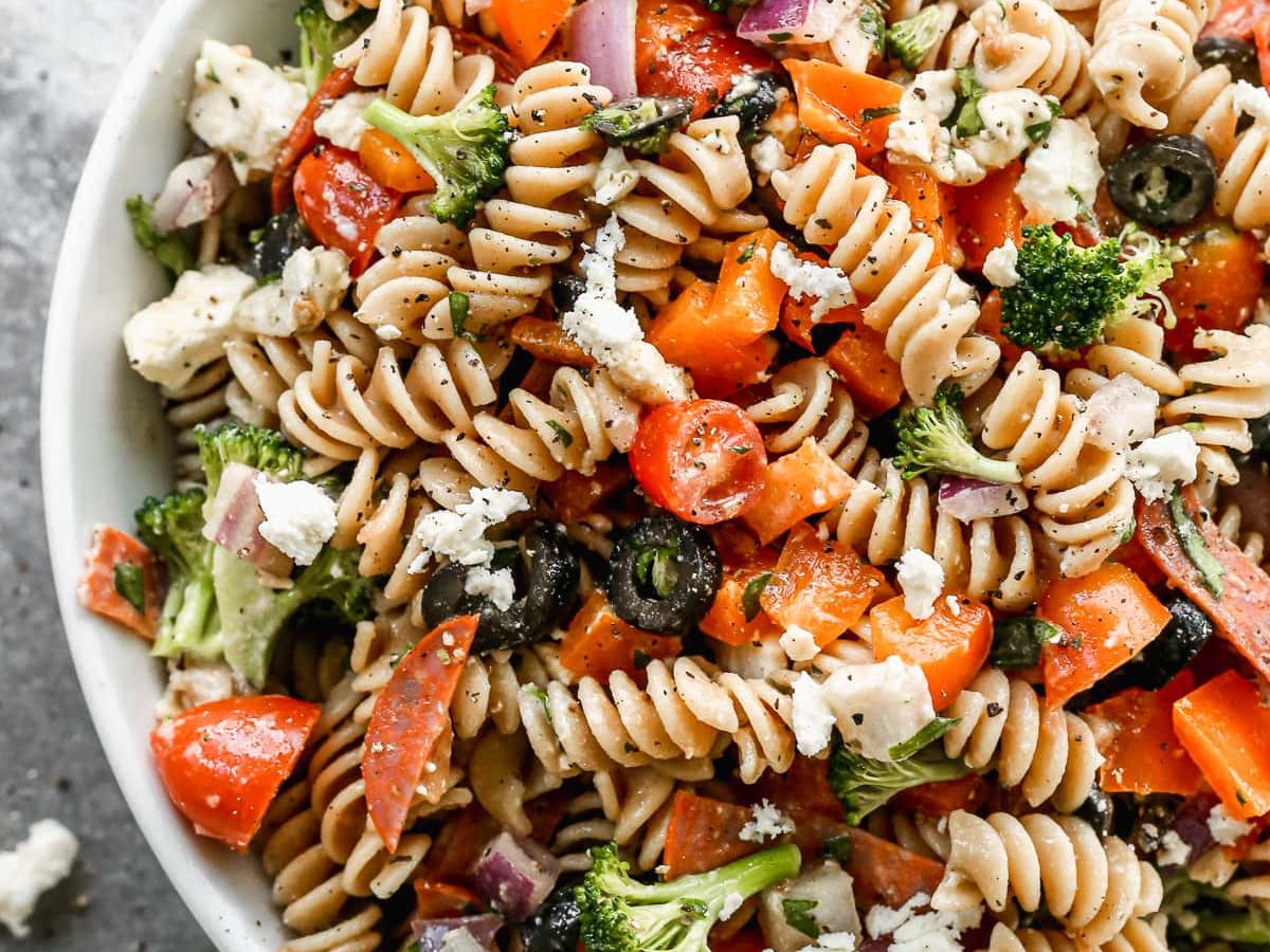 healthy Italian Pasta Salad in a bowl with pepperoni and healthy vegetables