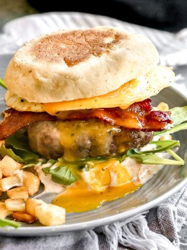 a breakfast burger with an egg, bacon, and cheese