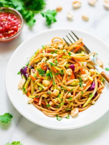 Asian Noodle Salad with Peanut Dressing. This is the BEST cold pasta salad recipe! Whole wheat pasta mixed with crunchy veggies in a sweet and spicy peanut sauce. Packed with flavor, healthy, and filling too! @wellplated