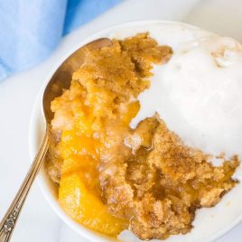 Crock Pot Peach Cobbler. This easy dessert is made entirely in your slow cooker! Juicy peaches, a sweet, buttery topping, and it couldn’t be simpler. Just dump the ingredients into your crockpot and walk away! @wellplated