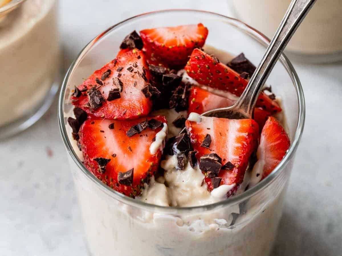 high-protein overnight oats topped with chocolate and strawberries