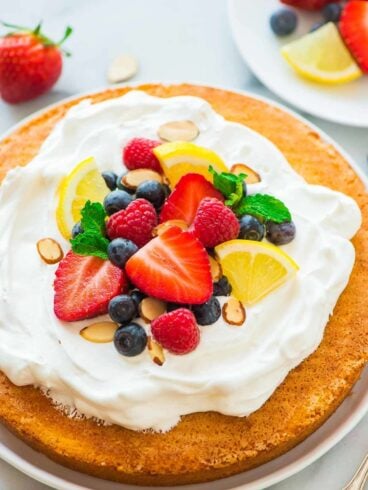Flourless Lemon Almond Cake with Fresh Berries – a light, fluffy, and gluten free dessert made with almond flour, eggs, and sugar. Simple, low carb, and perfect for any holiday or party! Recipe at wellplated.com | @wellplated