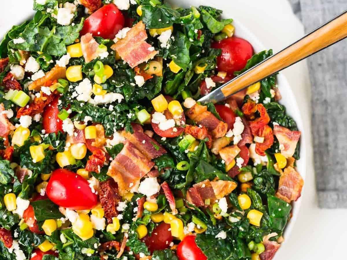 BLT Chopped Salad with Feta and Sweet Corn. Everyone’s favorite sandwich turned into an easy, delicious salad that’s perfect for parties and potlucks! Tastes great at room temperature and can last for days in the refrigerator, so it’s great for healthy meal planning too. The ultimate summer salad recipe! Recipe at wellplated.com | @wellplated