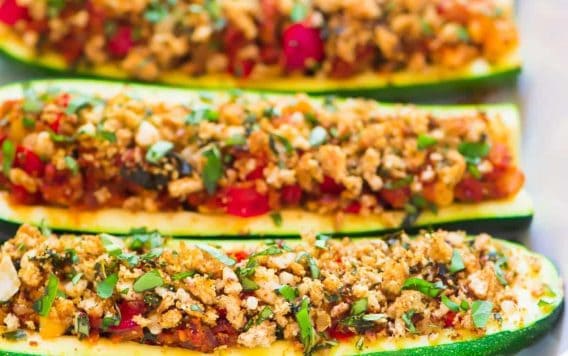 Healthy Italian Stuffed Zucchini Boats – low carb baked zucchini boats stuffed with lean ground turkey sausage, tomatoes, and topped with crispy basil breadcrumbs. An easy, healthy, all-in-one dinner that your whole family will love! Recipe at wellplated.com | @wellplated