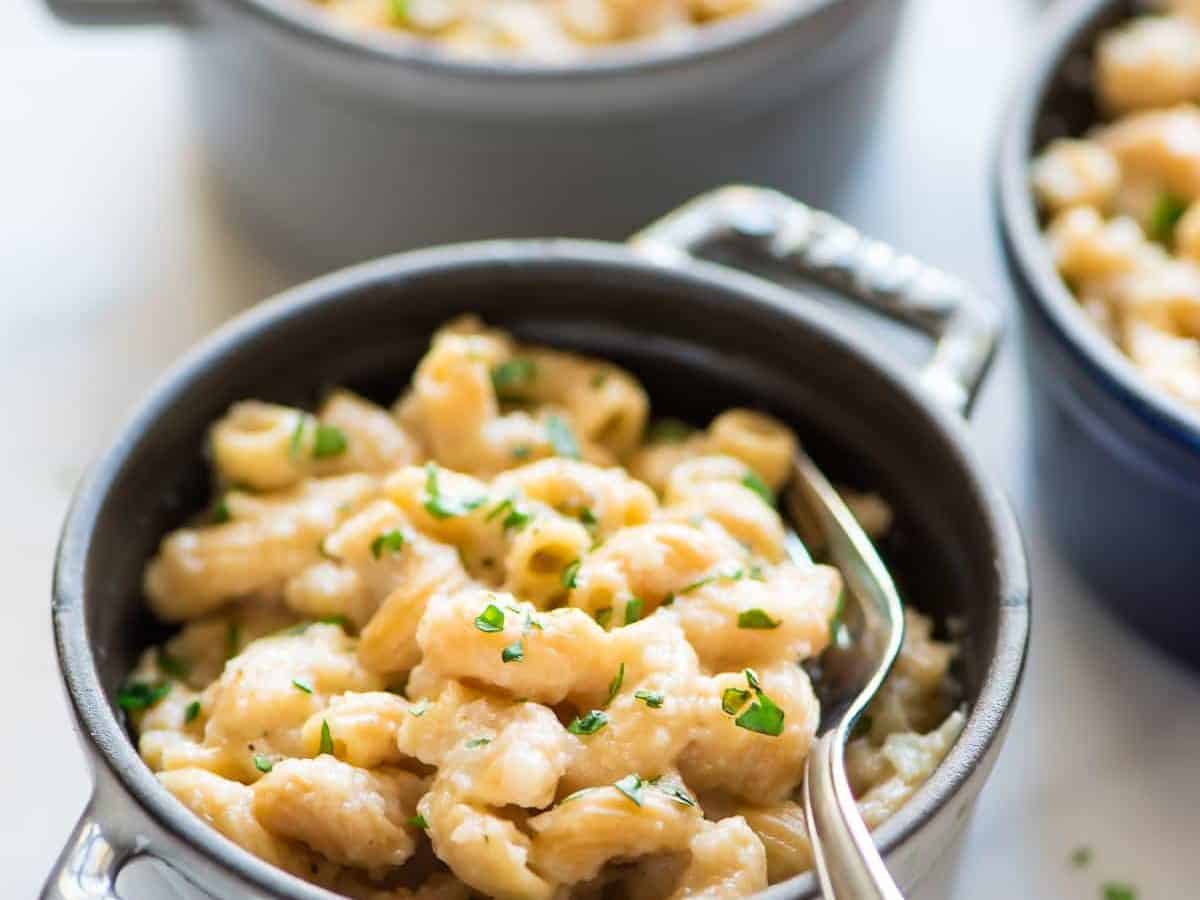Low carb Instant Pot Cauliflower Mac and Cheese. The BEST mac and cheese I’ve ever had. CREAMY, easy, and healthy, and you can’t taste the veggies! Riced cauliflower mixed with whole wheat pasta, in the best mac and cheese sauce. One of our favorite pressure cooker recipes!