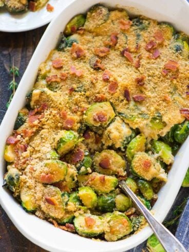 An easy, healthy recipe for Cheesy Brussels Sprouts Gratin with Gruyere, Bacon, and Crispy Breadcrumb Topping. TO DIE FOR! Everyone loves this cheesy brussel sprout casserole recipe! Great for Christmas, Thanksgiving, or anytime you need a crowd-pleasing side dish. #gratin #brusselsprout #easy #healthy