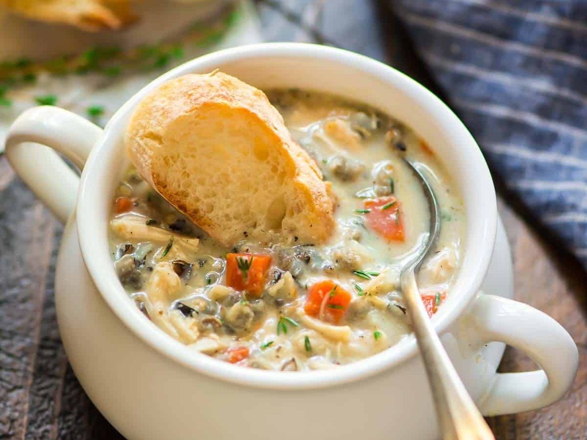 Slow Cooker Creamy Chicken and Wild Rice Soup in a soup crock