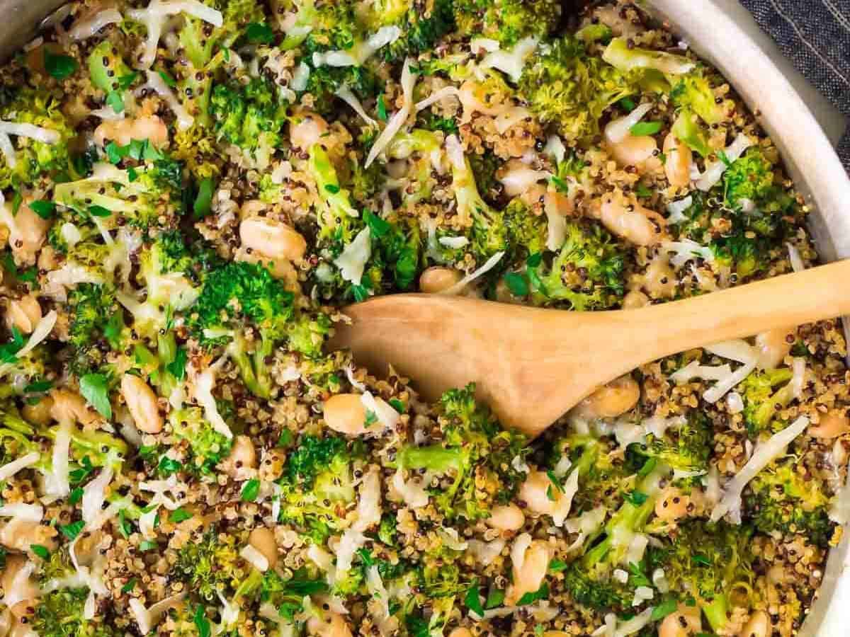 One Pan Cheesy Broccoli Quinoa Skillet with Parmesan and White Beans. An easy and filling vegetarian recipe that's great for quick dinners and healthy meal prep lunches.