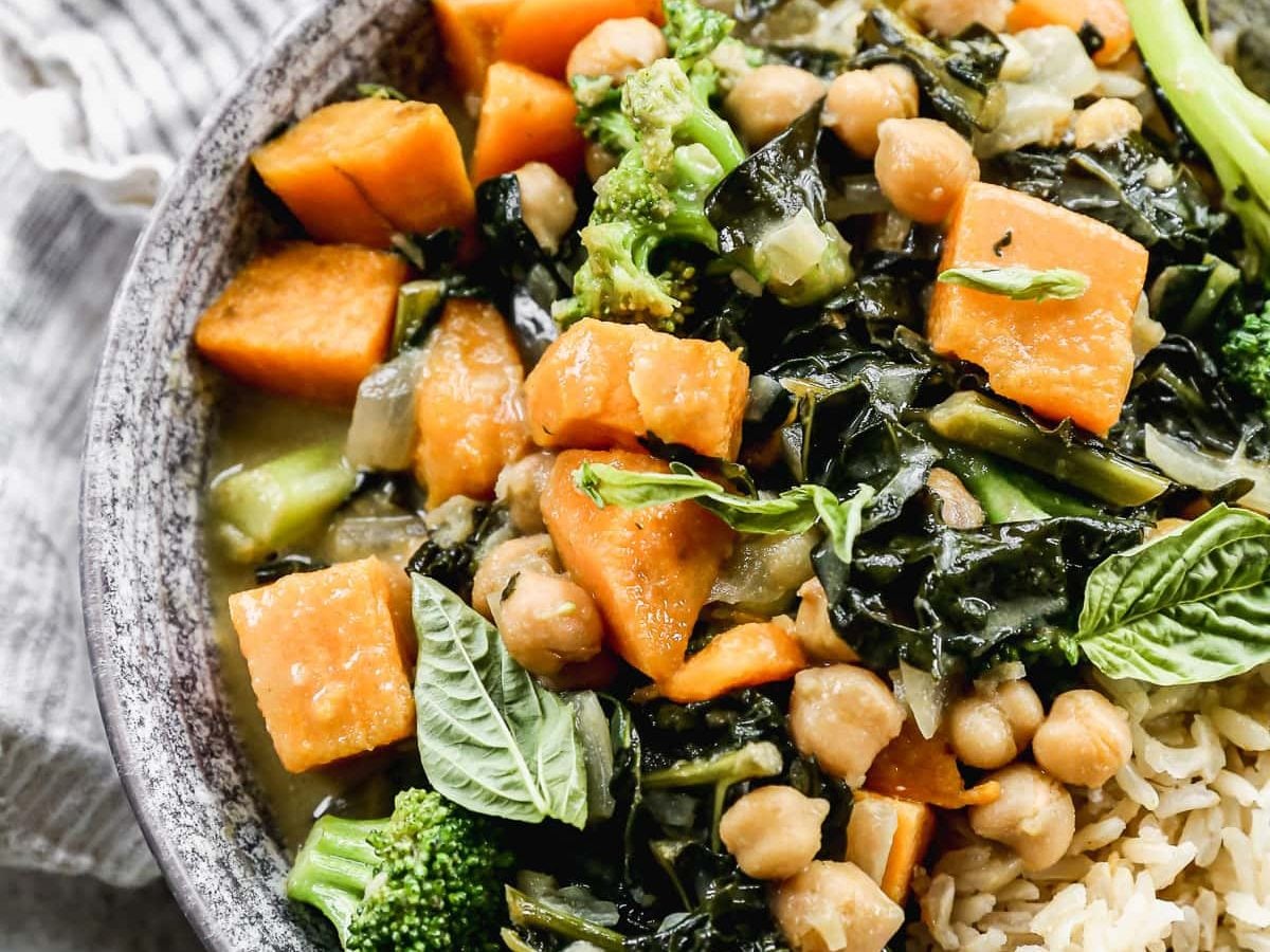 Easy Thai Chickpea Curry with sweet potato, kale, and coconut milk. Not too spicy, healthy, and made with easy to find ingredients! Super tasty and ready in 30 minutes, so it’s perfect for fast weeknight dinners. Vegan and gluten-free friendly recipes that's great leftover too!