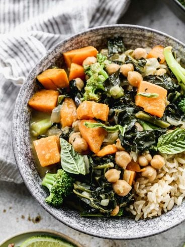 Easy Thai Chickpea Curry with sweet potato, kale, and coconut milk. Not too spicy, healthy, and made with easy to find ingredients! Super tasty and ready in 30 minutes, so it’s perfect for fast weeknight dinners. Vegan and gluten-free friendly recipes that's great leftover too!