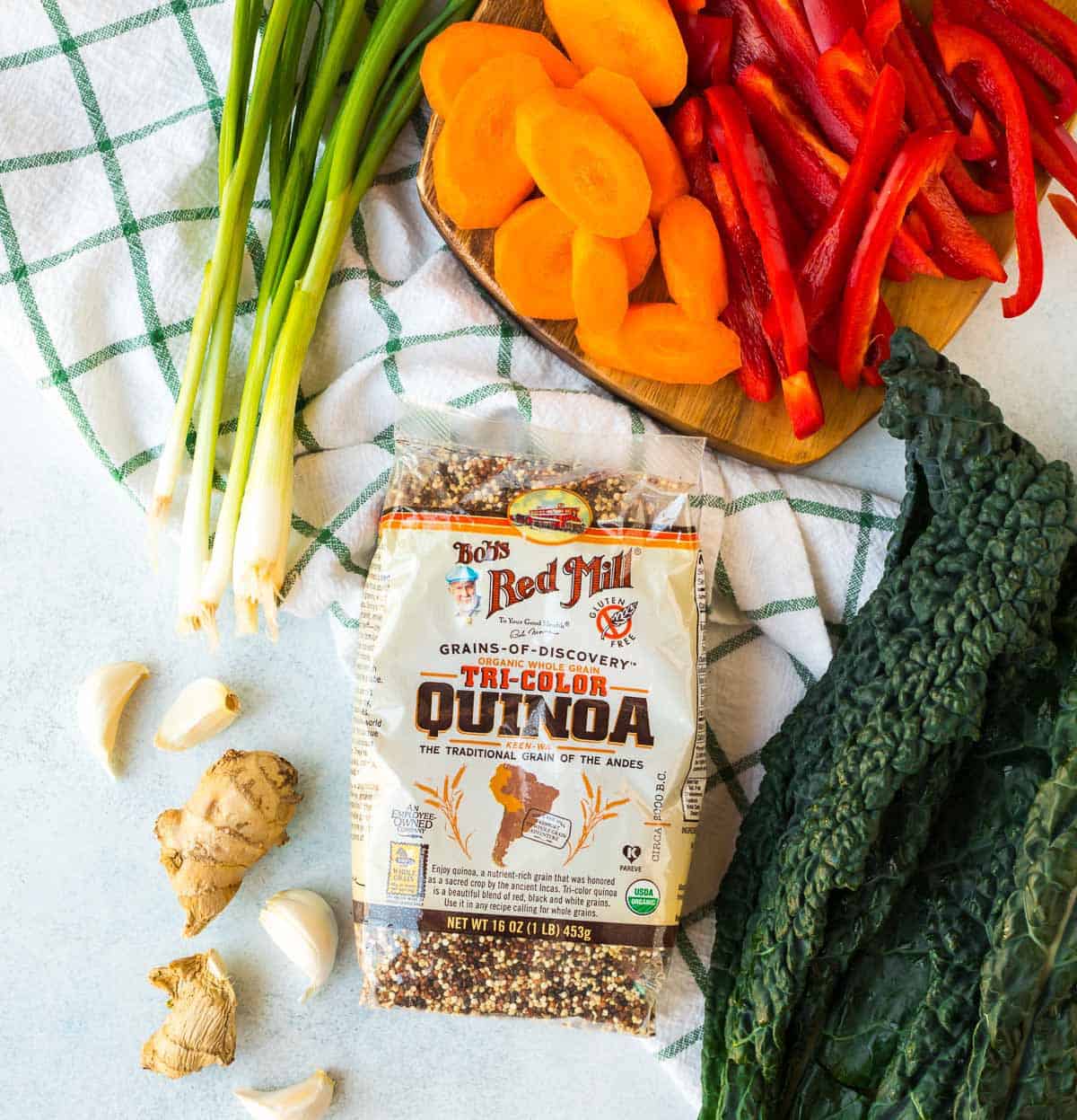 Teriyaki Salmon Quinoa Bowl. Delicious, easily adaptable, and ready in 30 minutes! This salmon quinoa kale bowl is packed with protein and veggies for nutritious meals.