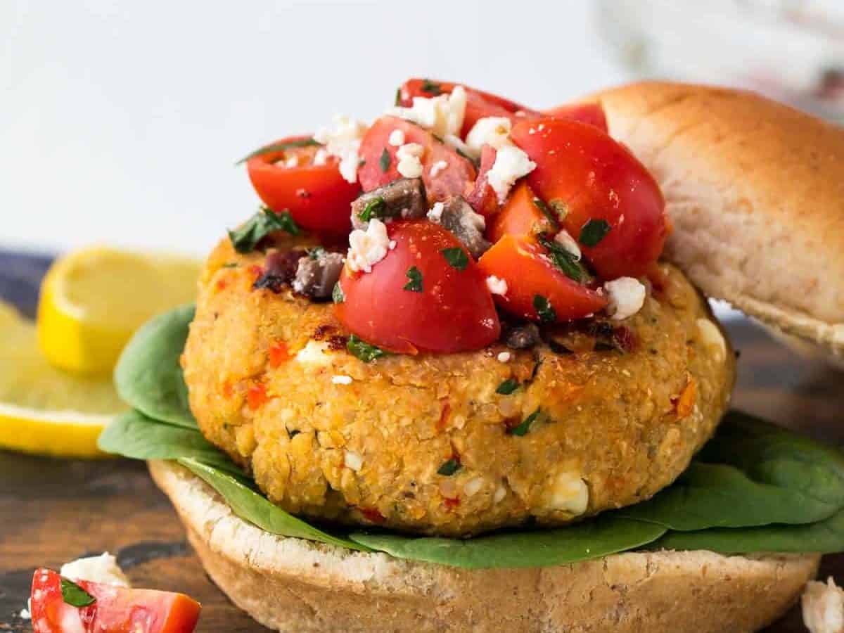 Mediterranean Quinoa Burger. Easy, healthy and protein-packed veggie burger recipe! Made with chickpea, feta, sun-dried tomatoes and herbs, this filling vegetarian recipe is packed with flavor.