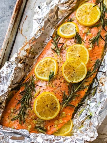 Easy Baked Salmon in Foil with Garlic, Lemon, and Herbs. One of the best simple, healthy recipes. Turns out perfectly every time!