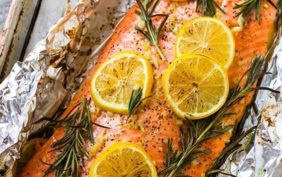 Easy Baked Salmon in Foil with Garlic, Lemon, and Herbs. One of the best simple, healthy recipes. Turns out perfectly every time!