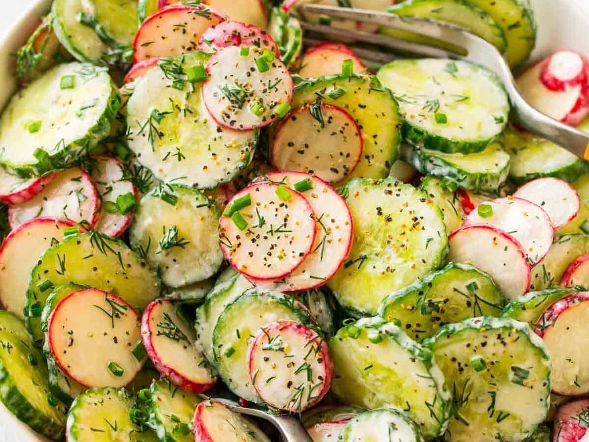 Healthy Creamy Cucumber Salad with Greek yogurt, radish, and dill. A light, bright, and refreshing version of old-fashioned cucumber salad that’s perfect for summer potlucks and BBQs!