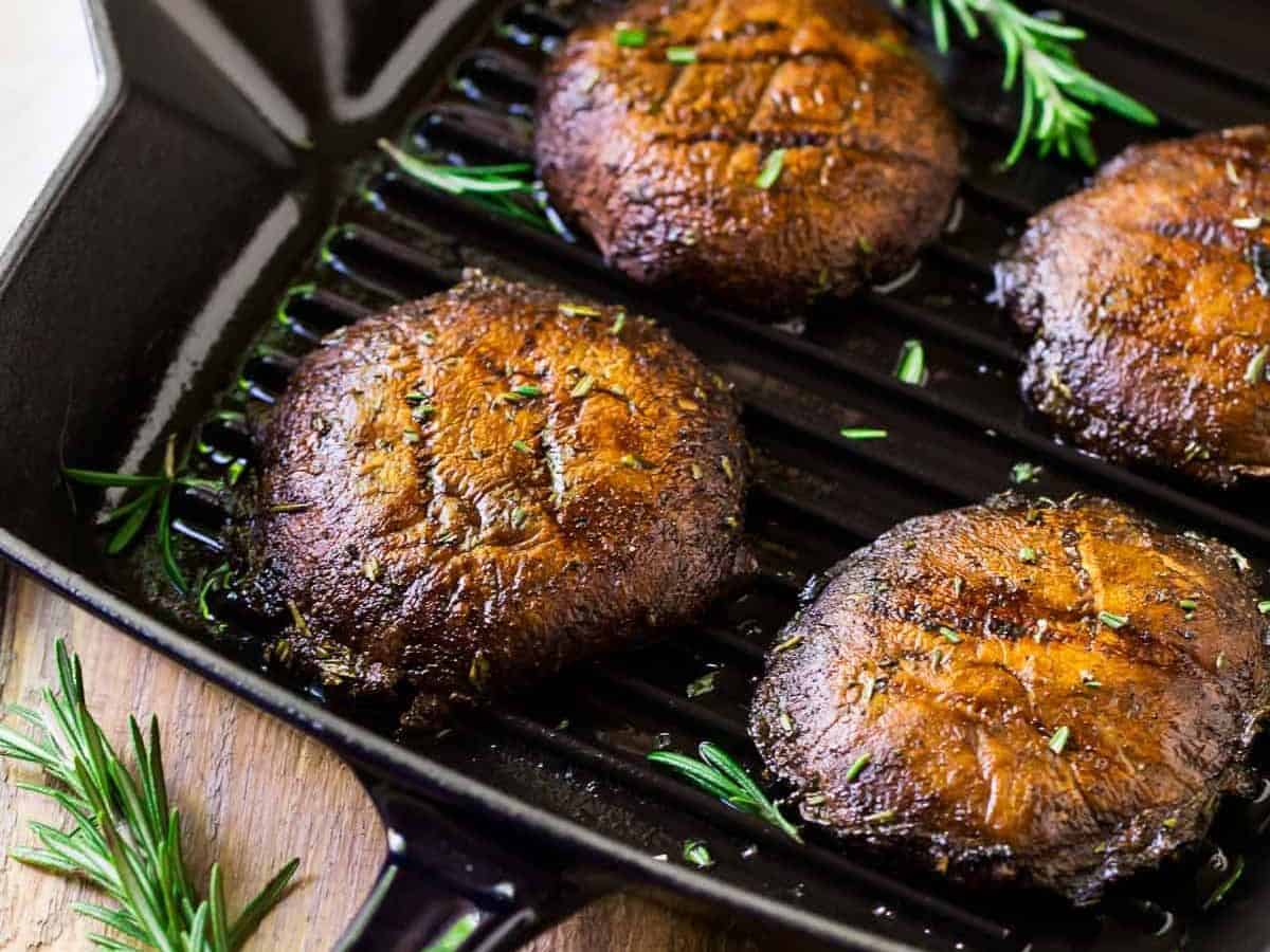 How to make the best Grilled Portobello Mushrooms. Easy, low-carb, vegan recipe that’s great for a portobello steak, grilled portobello mushroom burger, and Meatless Monday dinners. The simple portobello mushroom marinade gives them incredible flavor!