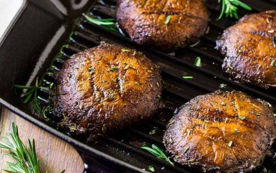 How to make the best Grilled Portobello Mushrooms. Easy, low-carb, vegan recipe that’s great for a portobello steak, grilled portobello mushroom burger, and Meatless Monday dinners. The simple portobello mushroom marinade gives them incredible flavor!