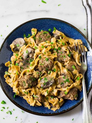 Instant Pot Beef Stroganoff. No canned soup! Easy, healthy beef stroganoff from scratch in the electric pressure cooker. Recipe uses Greek yogurt instead of sour cream and whole wheat noodles.