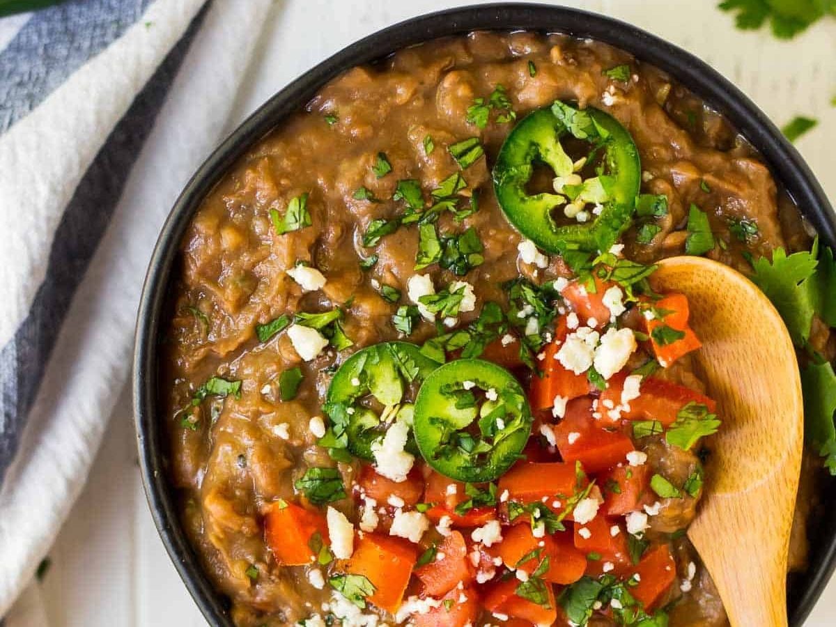 How to make the BEST Instant Pot Refried Beans! Easy no soak recipe. Healthy, vegan, and perfect for all of your favorite Mexican dishes! One of the best pressure cooking recipes. 