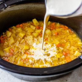 Easy, healthy Crockpot Potato Soup recipe. Creamy, cheesy, and loaded, this simple potato soup tastes decadent but is better for you!