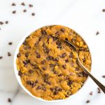 Edible cookie dough with chocolate chips in a white bowl