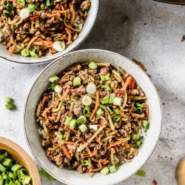 two bowls of healthy egg roll in a bowl with coleslaw mix and egg
