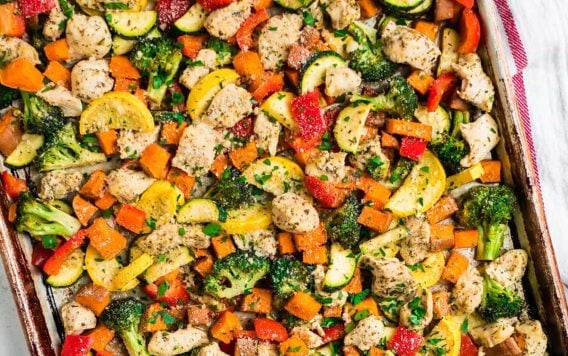 A sheet pan dinner with chicken and vegetables