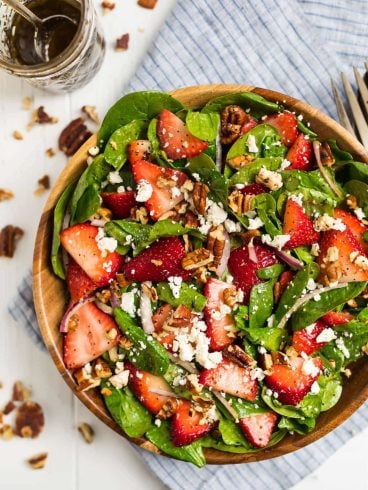 The best ever Spinach Strawberry Salad with Balsamic Poppyseed Dressing, pecans, and feta or goat cheese.