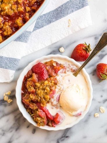 Easy Strawberry Crisp with healthy Oat topping and vanilla ice cream.