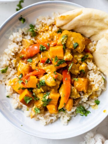 Slow Cooker Chicken Curry with an Indian coconut milk sauce and vegetables, served over rice