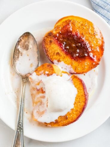 Baked Peaches in Maple Syrup with Brandy, Cinnamon, and Vanilla Ice Cream