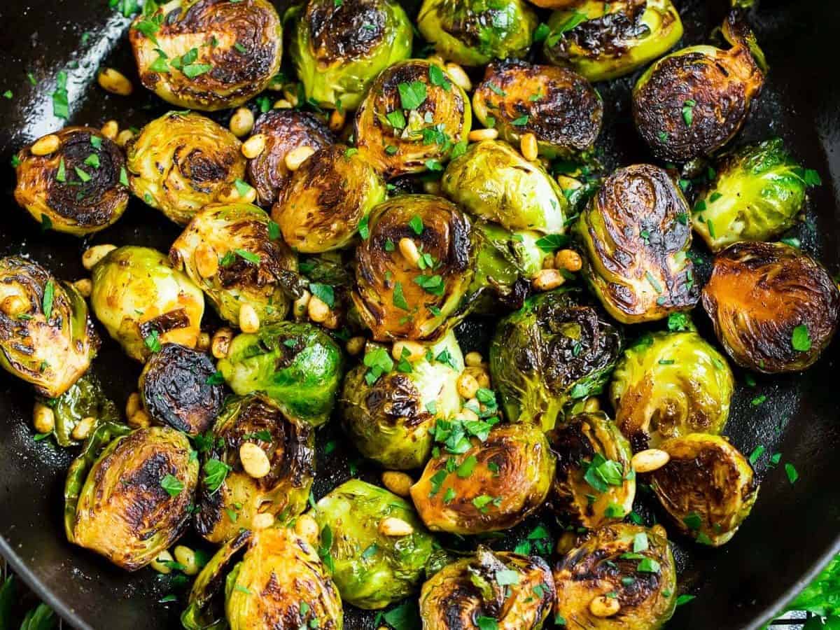 A pan of sautéed brussels sprouts with balsamic