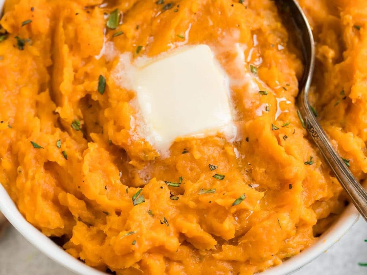 Creamy Instant Pot Mashed Sweet Potatoes in a white serving bowl