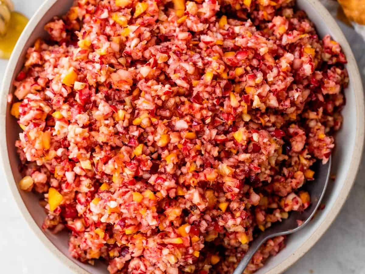 A white bowl with cranberry orange relish for Thanksgiving