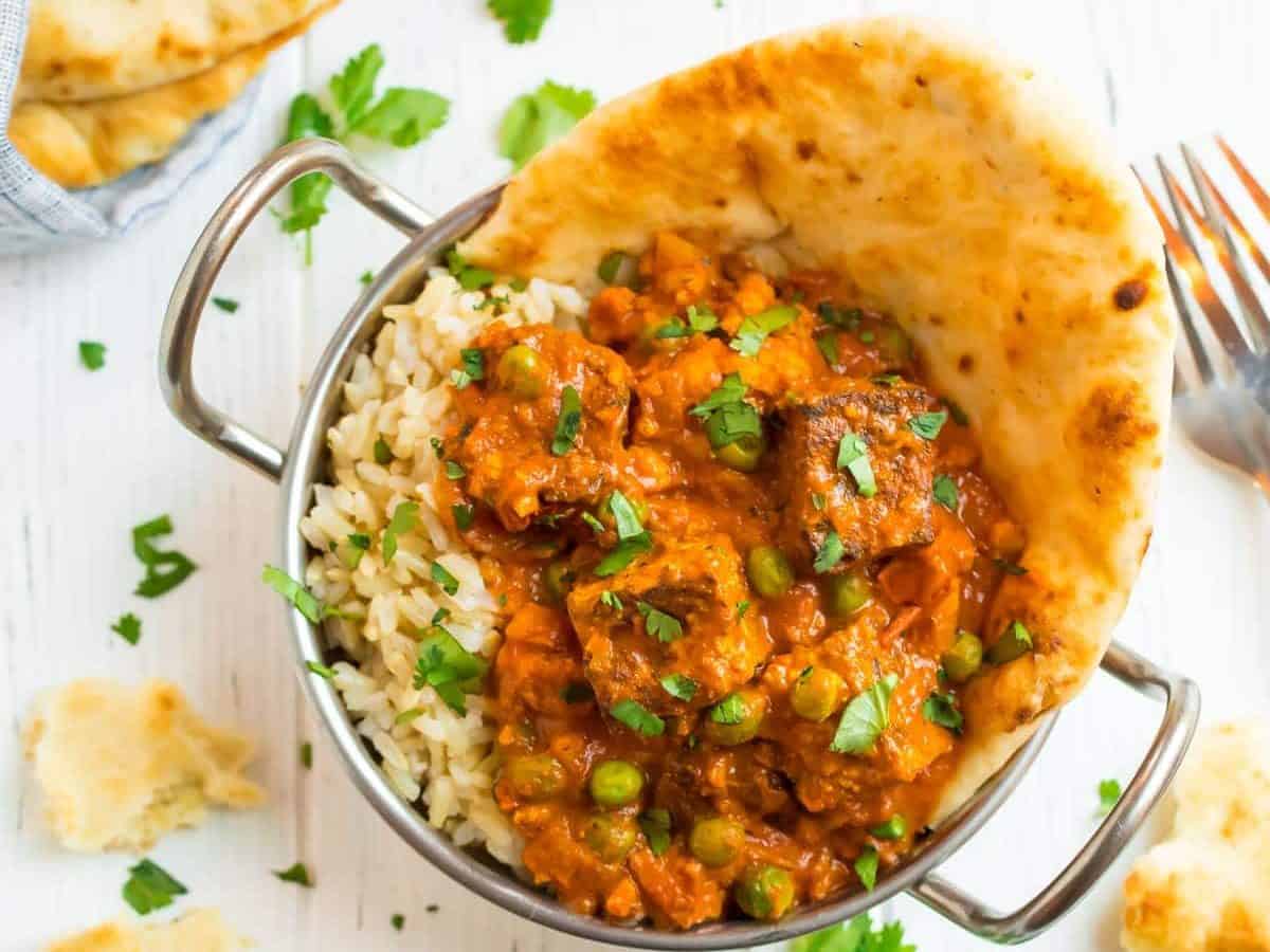 Creamy Tandoori Tofu Tikka Masala on rice with naan bread