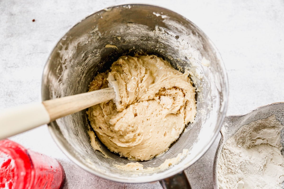 A hand mixer in batter