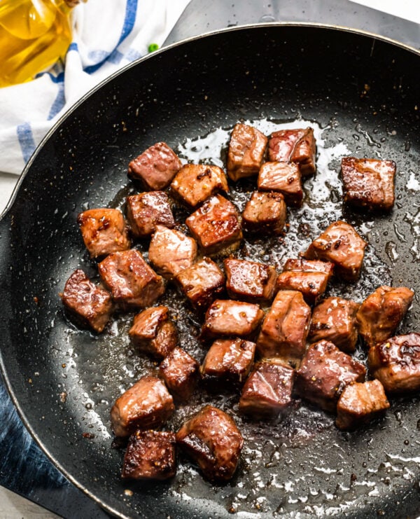 beef searing in a skillet