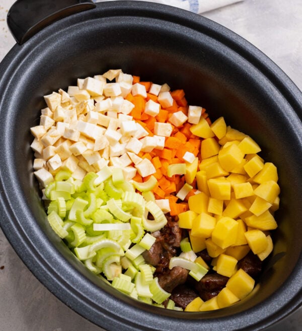celery, carrots, potatoes, and parsnips for vegetable beef soup in a crockpot